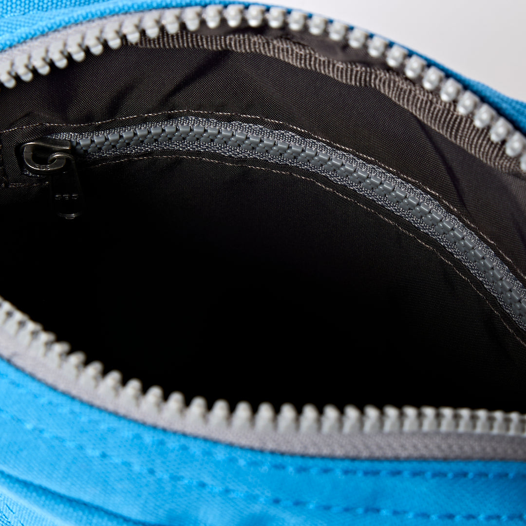 Bond Pocket Crossbody Bag in Malibu Blue Recycled Canvas