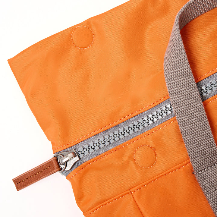 Canfield Roll Top Backpack in Jaffa Orange
