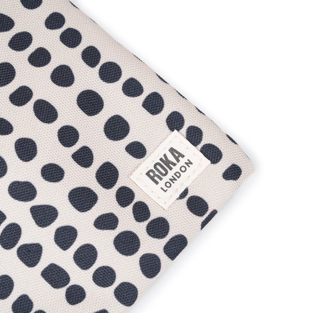 Chelsea Pocket Sling Bag in Linear Dot