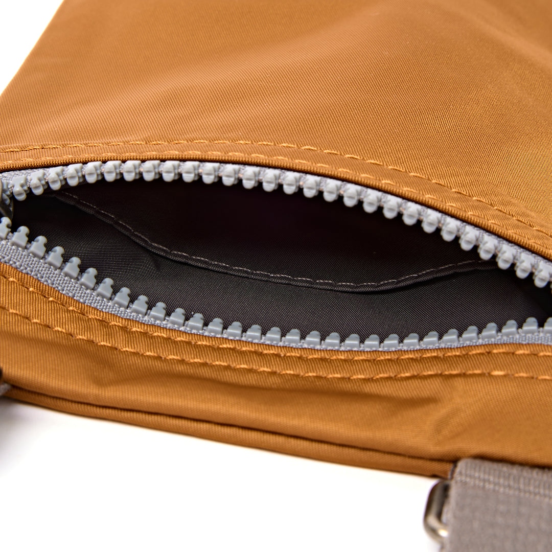 Chelsea Pocket Sling Bag in Biscuit