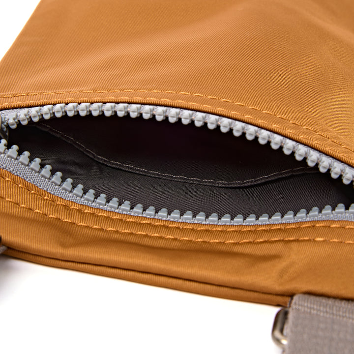 Chelsea Pocket Sling Bag in Biscuit