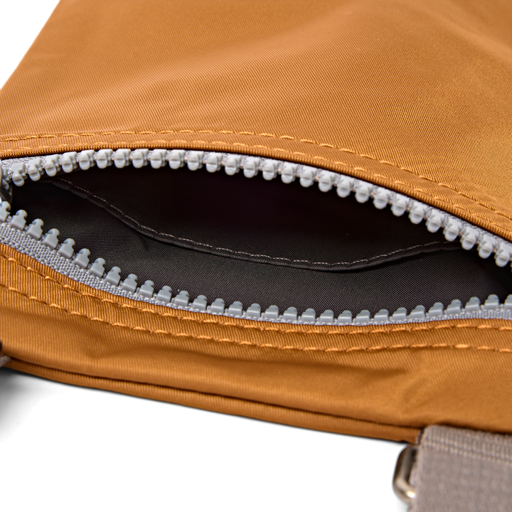 Chelsea Pocket Sling Bag in Biscuit