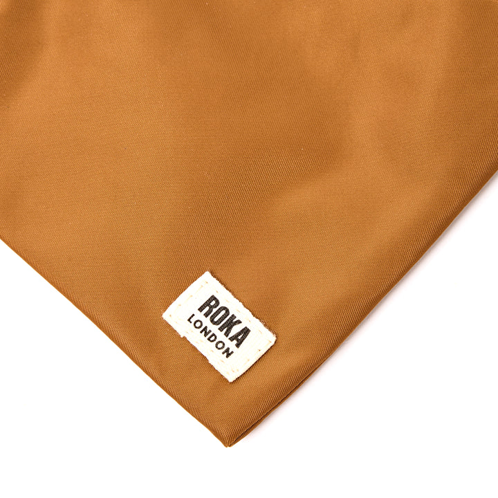 Chelsea Pocket Sling Bag in Biscuit