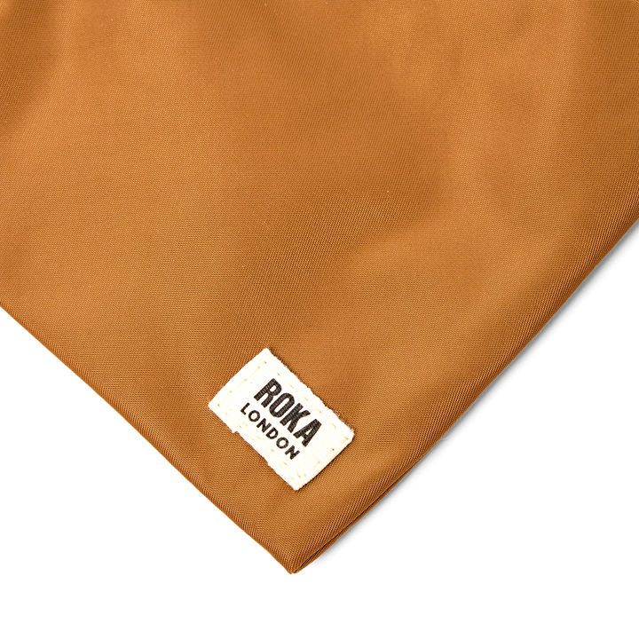 Chelsea Pocket Sling Bag in Biscuit