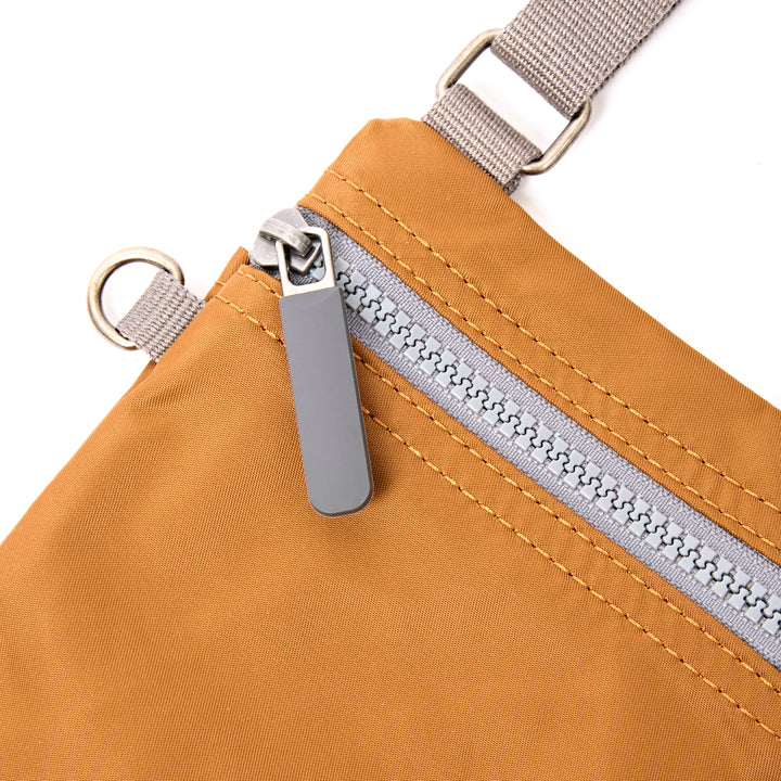 Chelsea Pocket Sling Bag in Biscuit