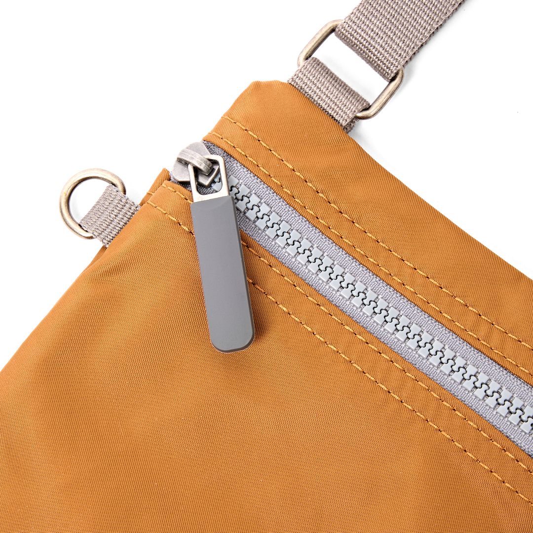 Chelsea Pocket Sling Bag in Biscuit