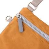 Chelsea Pocket Sling Bag in Biscuit