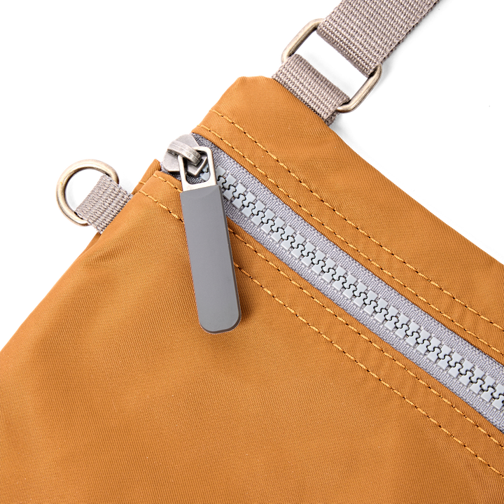 Chelsea Pocket Sling Bag in Biscuit