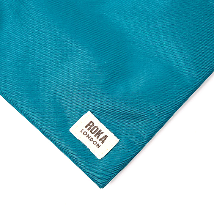 Chelsea Pocket Sling Bag in North Sea