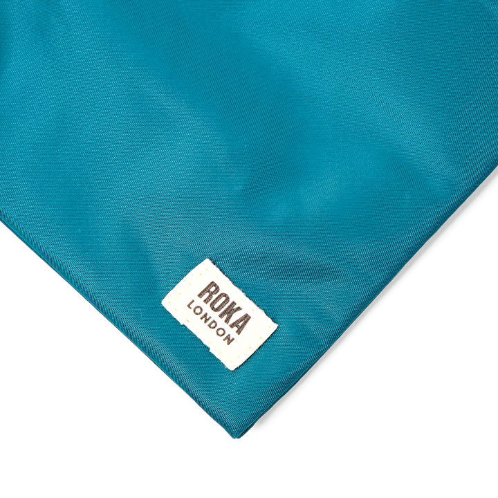 Chelsea Pocket Sling Bag in North Sea