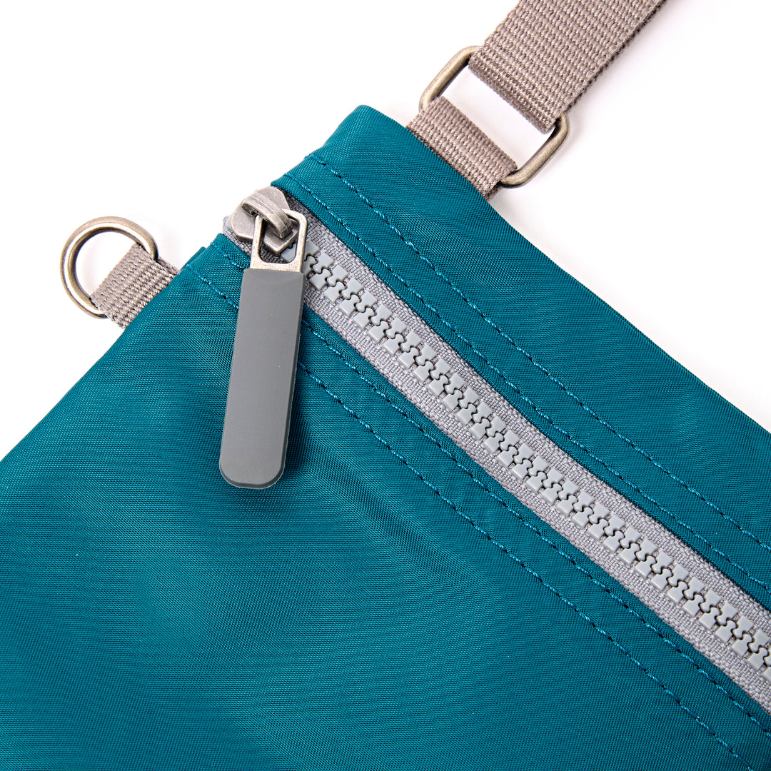 Chelsea Pocket Sling Bag in North Sea