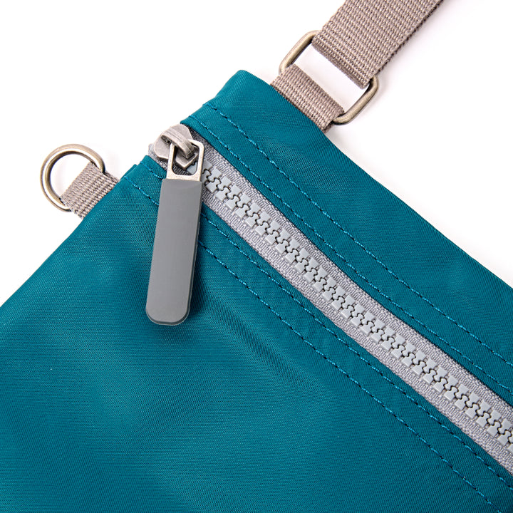 Chelsea Pocket Sling Bag in North Sea