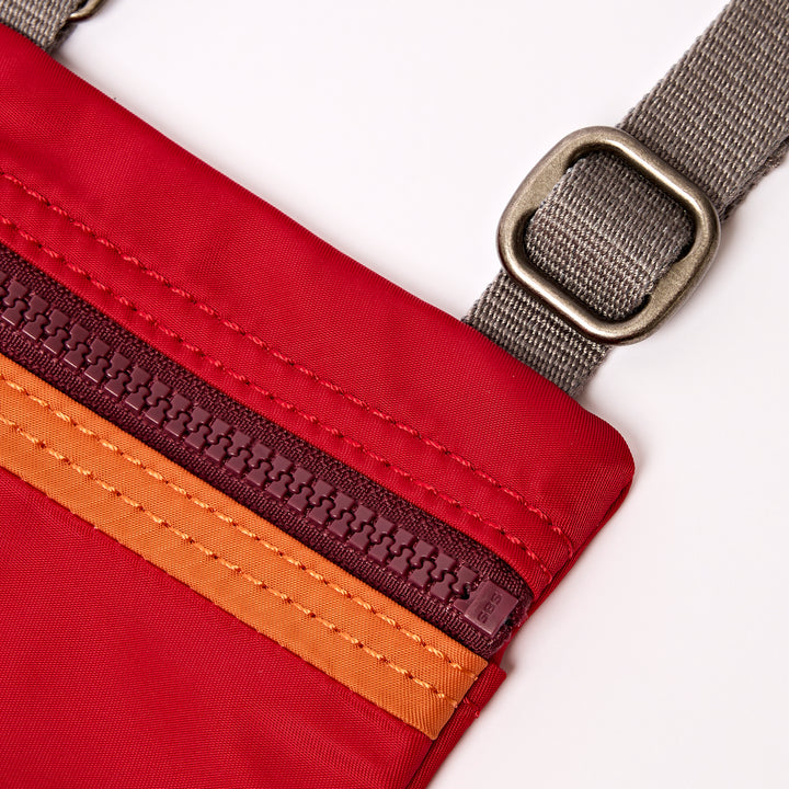 Chelsea Pocket Sling Bag in Cranberry Stripe