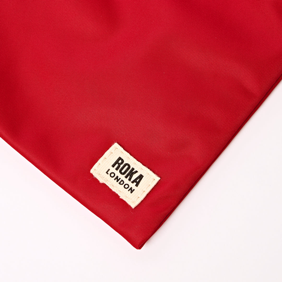 Chelsea Pocket Sling Bag in Cranberry Stripe