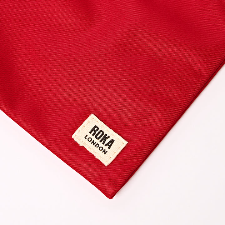 Chelsea Pocket Sling Bag in Cranberry Stripe