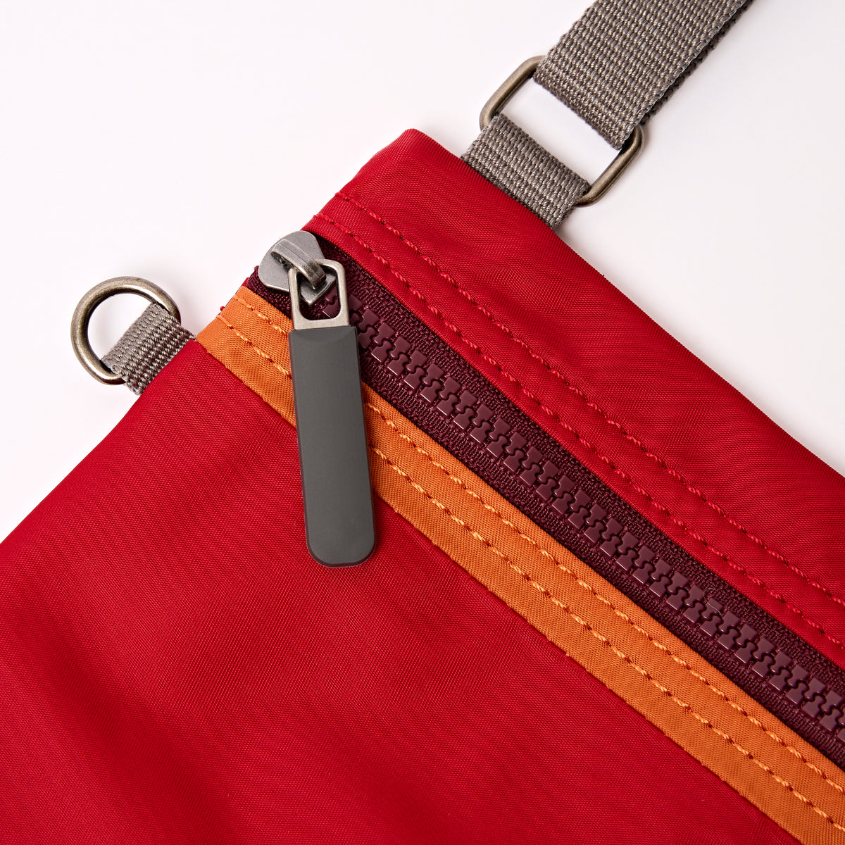 Chelsea Pocket Sling Bag in Cranberry Stripe