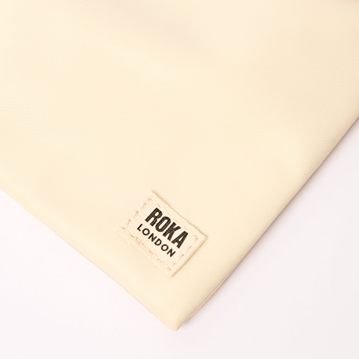 Chelsea Pocket Sling Bag in Wax Paper Stripe