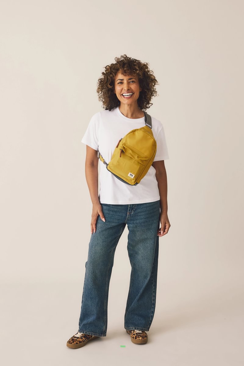 Willesden Sling Bag in Brown Dot on model, 5'4"